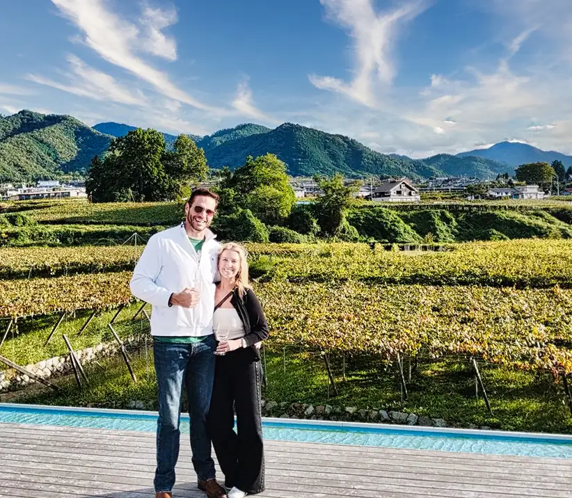 Wine tasting in vineyard setting in Yamanashi Japan with mountain views